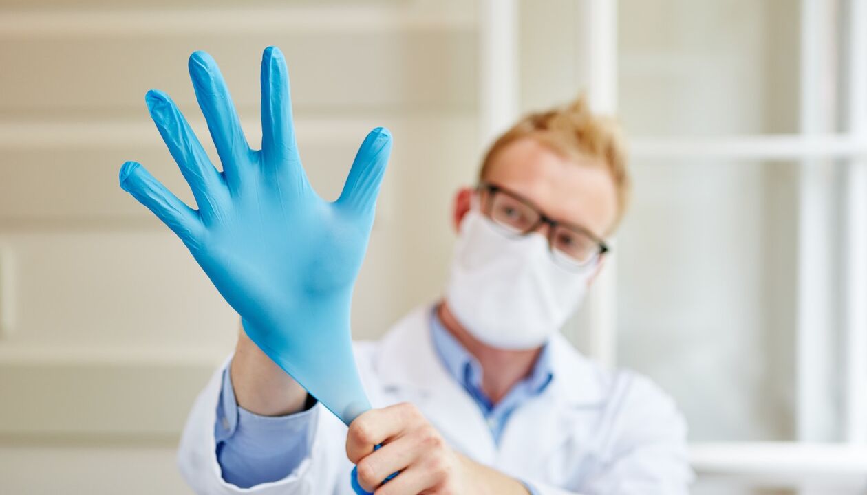 the doctor puts on a massage glove to prevent prostatitis